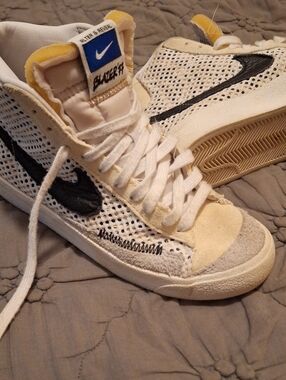 Nike White Mesh Mid-Top Sneakers with Black Swoosh and Yellow Tongue Accents
